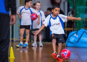 kids playing in soccer class